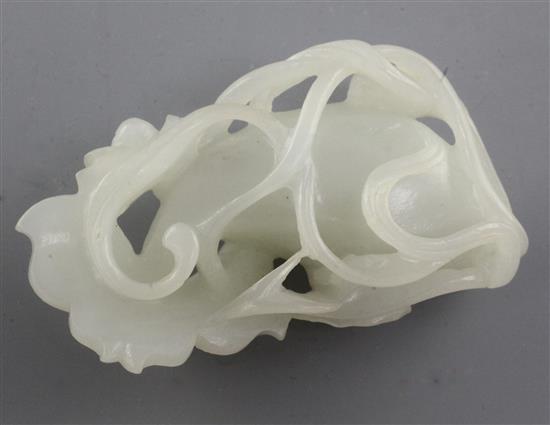 A Chinese white jade carving of a goldfish amid lotus, late 19th / early 20th century, 6.4cm